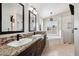 Elegant bathroom with dual sinks, soaking tub, and walk-in shower at 5544 E Paradise Ln, Scottsdale, AZ 85254