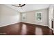 Main bedroom with vaulted ceiling, wood floors, and barn door to closet at 5544 E Paradise Ln, Scottsdale, AZ 85254