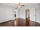 Bedroom with dark wood floors, double doors to closet, and access to bathroom at 5544 E Paradise Ln, Scottsdale, AZ 85254