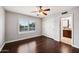 Spacious bedroom with dark wood floors and private bathroom access at 5544 E Paradise Ln, Scottsdale, AZ 85254