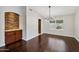 Formal dining area with hardwood floors and a stylish chandelier at 5544 E Paradise Ln, Scottsdale, AZ 85254