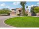 Two-story home with attached garage and a manicured lawn at 5544 E Paradise Ln, Scottsdale, AZ 85254