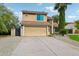 Two-story home with attached garage and attractive landscaping at 5544 E Paradise Ln, Scottsdale, AZ 85254