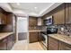 Modern kitchen with granite counters and stainless steel appliances at 5544 E Paradise Ln, Scottsdale, AZ 85254