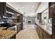 Modern kitchen with granite counters, stainless steel appliances, and mosaic backsplash at 5544 E Paradise Ln, Scottsdale, AZ 85254