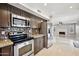 Modern kitchen with granite counters and stainless steel appliances at 5544 E Paradise Ln, Scottsdale, AZ 85254