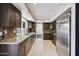 Modern kitchen with granite counters, stainless steel appliances, and mosaic backsplash at 5544 E Paradise Ln, Scottsdale, AZ 85254