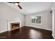 Bright living room with hardwood floors, fireplace, and high ceilings at 5544 E Paradise Ln, Scottsdale, AZ 85254