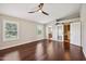 Spacious main bedroom with high ceilings, wood floors, and ensuite bathroom at 5544 E Paradise Ln, Scottsdale, AZ 85254