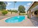Refreshing kidney-shaped pool in a backyard oasis at 5544 E Paradise Ln, Scottsdale, AZ 85254