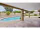 Inviting kidney-shaped pool with paved patio at 5544 E Paradise Ln, Scottsdale, AZ 85254