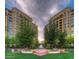 Courtyard with fountain and landscaping between two buildings at 7175 E Camelback Rd # 504, Scottsdale, AZ 85251