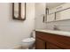 Clean bathroom with wood vanity and a single sink at 8027 N 32Nd Ave, Phoenix, AZ 85051