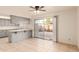 Gray kitchen with breakfast bar and sliding glass door at 8027 N 32Nd Ave, Phoenix, AZ 85051