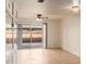 Living room with tile floors, sliding glass doors, and view of patio at 8027 N 32Nd Ave, Phoenix, AZ 85051