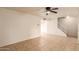 Living room with tile floors, ceiling fan, and stairway at 8027 N 32Nd Ave, Phoenix, AZ 85051