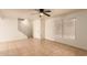 Living room with tile floors, ceiling fan, and stairway at 8027 N 32Nd Ave, Phoenix, AZ 85051