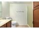 Bathroom with shower, toilet and wood vanity at 8201 N 21St Dr # C107, Phoenix, AZ 85021