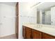 Clean bathroom with wood vanity, large mirror and shower at 8201 N 21St Dr # C107, Phoenix, AZ 85021