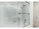 Clean bathroom with shower/tub combo and tiled walls at 8201 N 21St Dr # C107, Phoenix, AZ 85021