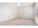 Spacious bedroom with tile flooring and ceiling fan at 8201 N 21St Dr # C107, Phoenix, AZ 85021