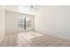 Well-lit bedroom with tile flooring and ceiling fan at 8201 N 21St Dr # C107, Phoenix, AZ 85021