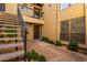 Exterior view of condo building with stairs and landscaping at 8201 N 21St Dr # C107, Phoenix, AZ 85021