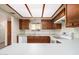 Kitchen with wooden cabinets and a skylight at 8201 N 21St Dr # C107, Phoenix, AZ 85021
