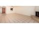 Open living room with tile floors, fireplace and view of kitchen at 8201 N 21St Dr # C107, Phoenix, AZ 85021