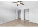 Bedroom with tile floors, ceiling fan and mirrored closet doors at 8428 N 33Rd Dr, Phoenix, AZ 85051