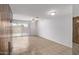 Dining area with tile floors, sliding glass door, and wood paneling at 8428 N 33Rd Dr, Phoenix, AZ 85051