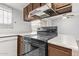Kitchen with stove, cabinets, and sliding door access at 8428 N 33Rd Dr, Phoenix, AZ 85051