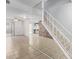 Living room with mirrored wall and staircase at 8428 N 33Rd Dr, Phoenix, AZ 85051