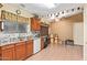 Bright kitchen with wood cabinets and a dishwasher at 936 E Escuda Dr, Phoenix, AZ 85024