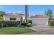 White stucco house with terracotta tile roof, two-car garage, and landscaped front yard at 11615 E Terra Dr, Scottsdale, AZ 85259