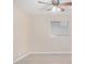 Bright bedroom with ceiling fan, window blinds, and light wood-look flooring at 1340 N Recker Rd # 256, Mesa, AZ 85205