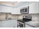Kitchen features granite countertops and stainless steel appliances at 1340 N Recker Rd # 256, Mesa, AZ 85205