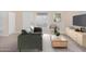 Bright living room featuring a sofa, armchair, and coffee table at 1340 N Recker Rd # 256, Mesa, AZ 85205