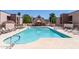 Community pool with plenty of lounge chairs for relaxation at 1340 N Recker Rd # 256, Mesa, AZ 85205