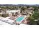 Elevated view of community pool with surrounding lounge chairs at 1340 N Recker Rd # 256, Mesa, AZ 85205