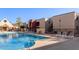 Inviting community pool with surrounding lounge chairs at 1340 N Recker Rd # 256, Mesa, AZ 85205