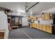 Garage with overhead storage and built-in cabinets at 17219 N 19Th Run, Phoenix, AZ 85022