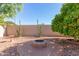 Backyard with fire pit and desert landscaping at 20047 N 109Th Dr, Sun City, AZ 85373