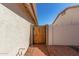 Private backyard access with a wooden gate at 20047 N 109Th Dr, Sun City, AZ 85373