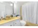 Clean bathroom with single sink vanity, shower/tub combo, and white toilet at 2650 W Union Hills Dr # 155, Phoenix, AZ 85027