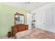 Bedroom with a dresser, full bed, and view into the kitchen at 2650 W Union Hills Dr # 155, Phoenix, AZ 85027