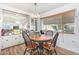 Dining area with round table, four chairs and view to exterior at 2650 W Union Hills Dr # 155, Phoenix, AZ 85027