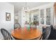 Small dining area with wood table and four chairs at 2650 W Union Hills Dr # 155, Phoenix, AZ 85027