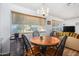 Dining area with round table, four chairs and view to exterior at 2650 W Union Hills Dr # 155, Phoenix, AZ 85027