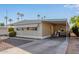 Front view of a manufactured home with a carport at 2650 W Union Hills Dr # 155, Phoenix, AZ 85027